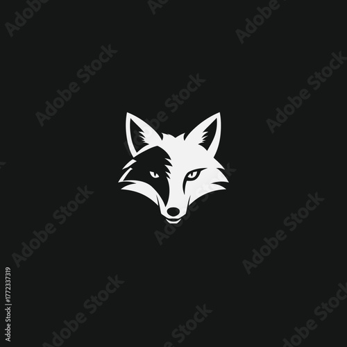Modern black and white fox head logo design. Minimalist graphic illustration of a wild animal face with strong contrast and sharp lines.