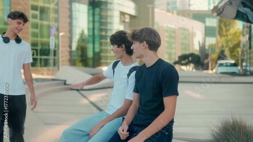 Three teenagers greeting with a friendly handshake and smiling in the city
