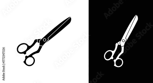 A black and white graphic icon of tailor's scissors on contrasting backgrounds.