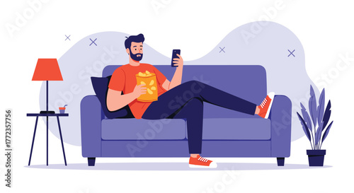 A man relaxing comfortably on a sofa, eating chips, and scrolling on his smartphone at home.