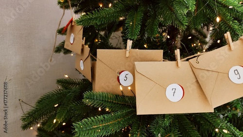 Preparing an Advent calendar for Christmas. Eco-craft envelopes with numbers for children. Christmas background, Advent from small craft envelopes.