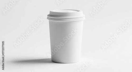 Wallpaper Mural A simple white disposable coffee cup stands upright against a minimalistic background, emphasizing its sleek design. Torontodigital.ca