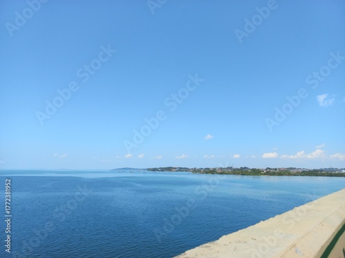 Ocean view with water color gradation and clear blue sky