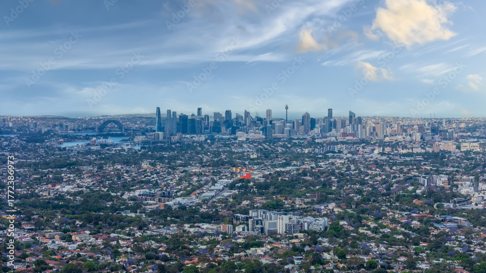Naklejka premium Panorama Sunset aerial drone view of western Sydney Suburbs of Canterbury Burwood Ashfield Marrickville Campsie with Houses roads and parks in Sydney New South Wales NSW Australia