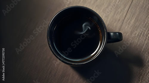 Steaming Black Coffee in Dark Mug on Wooden Table Top View