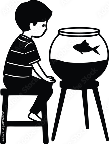 boy on stool peeking into a fishbowl at a single goldfish on a wooden table