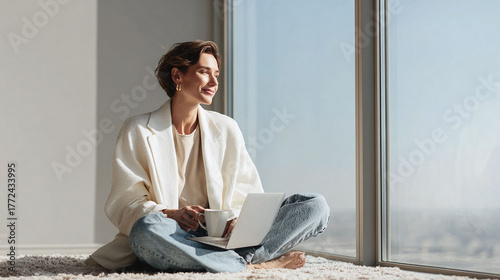 Serene woman with laptop, enjoying a peaceful moment by a bright window. Reflects worklife balance, focus, and modern lifestyle. Ideal for wellbeing  career themes.