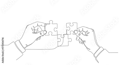 Two hands are connecting puzzle pieces together, symbolizing teamwork and problem solving.