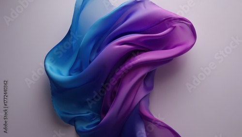 Elegant blue and purple silk fabric flowing in the air on white background