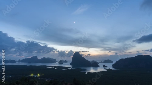 Sunrise timelapse at Samet Nangshe viewpoint with rain clouds, glowing sun and tropical seascape
