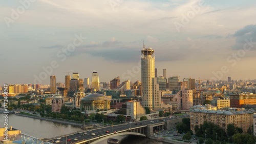 Rooftop view of Moscow with river and House of Music surrounded by city skyline at sunset