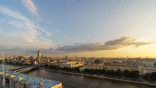 Timelapse rooftop view of Moscow with river and House of Music surrounded by city skyline at sunset