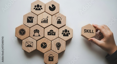 Hand adding a skill tile to a honeycomb of business icons