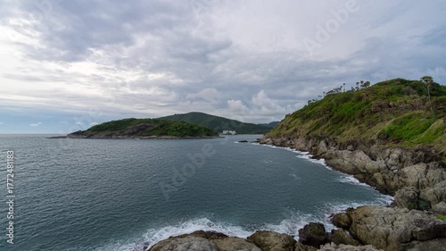 Sunset timelapse at Promthep Cape in Phuket with ocean waves, tropical coastline and colorful evening sky