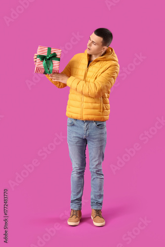 Young man in warm puffer ja...
