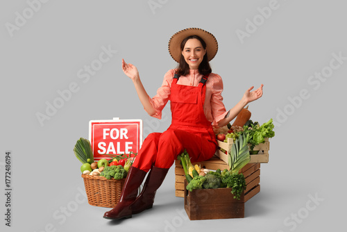 Female farmer with fresh ve...