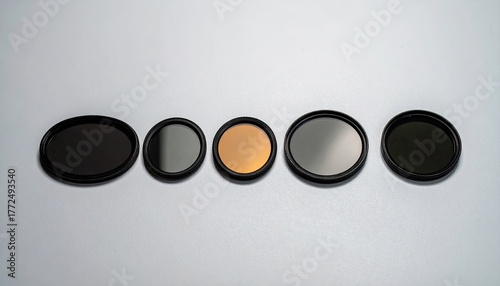 Five Round Camera Filters on White Background