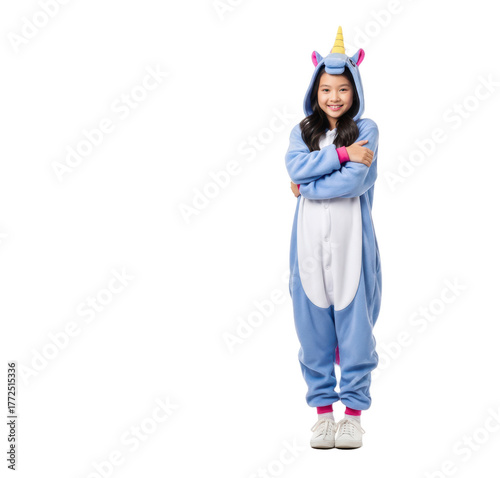 A young woman in a blue unicorn costume standing with her arms crossed, smiling confidently, against transparent background