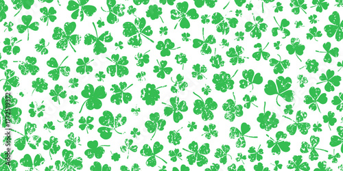 Shamrock or green clover leaves pattern background flat design vector illustration. St Patrick Day shamrock symbols decorative elements horizontal pattern texture.