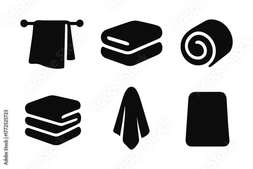 Simple black towel icons in minimalist silhouette style