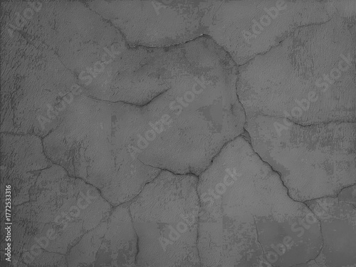 Monochrome fragment of a grey concrete wall with cracks.