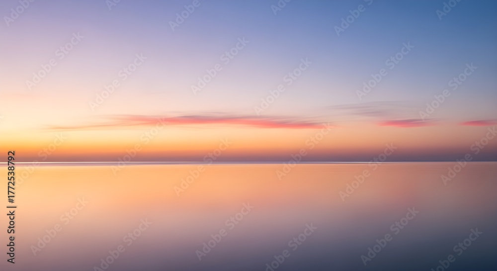Obraz premium Serene Horizon Sunrise Over Calm Water