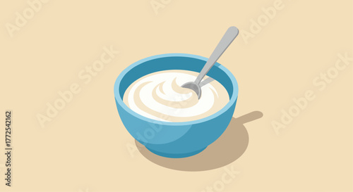 Creamy yogurt swirl in a blue bowl with a spoon, ready for a healthy breakfast or snack