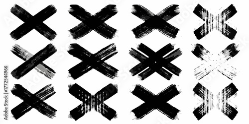 Collection of twelve diverse black and white brush stroke x marks and crosses on a white background