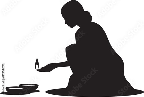 Silhouette of a woman in traditional clothing lighting a diya oil lamp female person