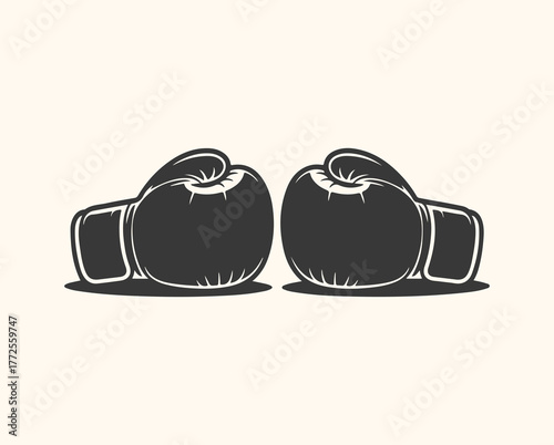 A pair of black boxing gloves facing each other on a light cream background, symbolizing combat and sport