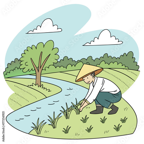 Asian man in conical hat tending to the rice fields near a river