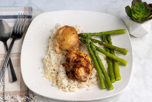 chicken thighs  on rice  with asparagus