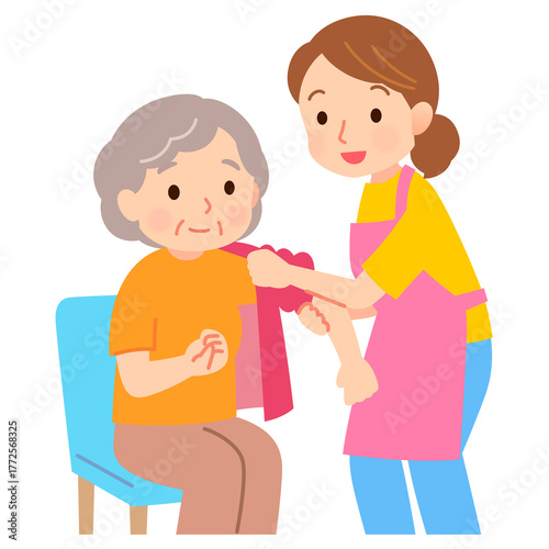 高齢者の着替えを手助けする介護士　介助　介護