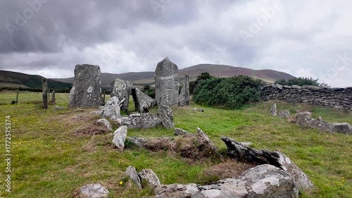 Ancient stone circle and chambered tomb on Manx moor, offering expansive countryside views toward Maughold.