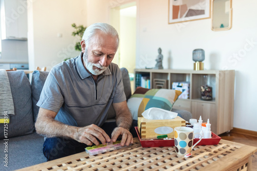 Canvas Print Container, senior man and organise pills tablet, health medication or pharmaceutical prescription