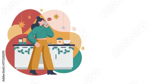 Woman on a phone call in a holidaydecorated kitchen multitasking while preparing for Christmas