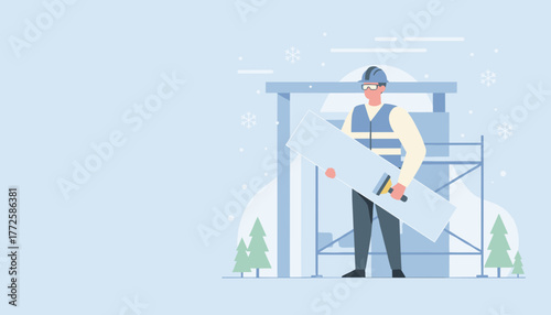 Worker in safety gear holding panel at winter construction site Building and industrial labor