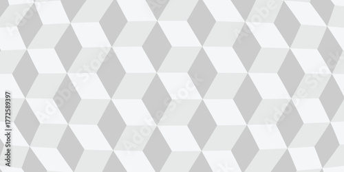 Abstract geometric background featuring a repeating pattern of grey and white 3D cubes or rhombuses, creating an optical illusion of depth. Seamless texture for modern design.