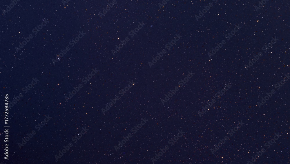 Obraz premium Countless stars spread across the nighttime sky, a reminder of celestial wonders