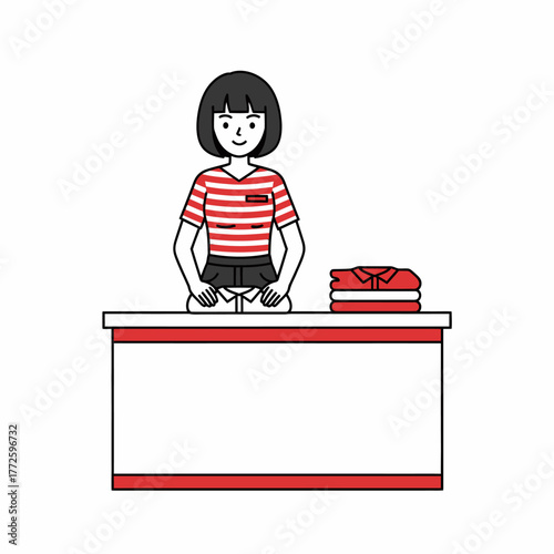 Friendly female clothing store employee standing behind a counter.