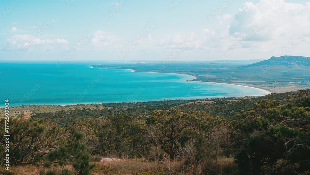 Obraz premium Sea and historic salt flats seen from a mountainous viewpoint