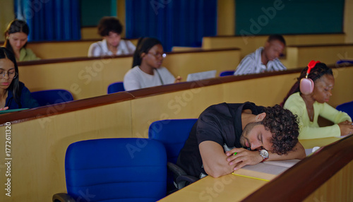 фотографія Indian young adult gen z tired male man feel bad unwell lack energy fall asleep need rest doze take nap on desk table