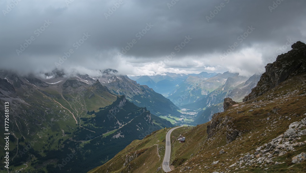 Obraz premium Scenic vistas along a trail in the Swiss Alps under a misty sky, highlighting seasonal change