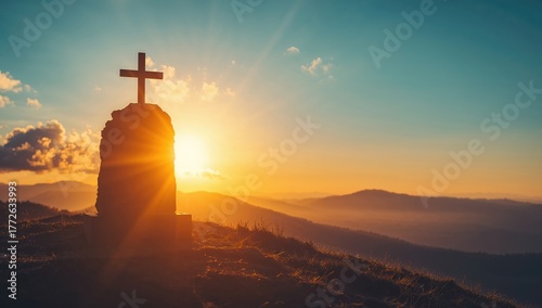 Easter and Good Friday theme, Vacant grave marker with cross against dawn mountain scenery, reflection of renewal
