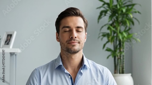 Businessman meditating in modern office environment practicing mindfulness and stress relief