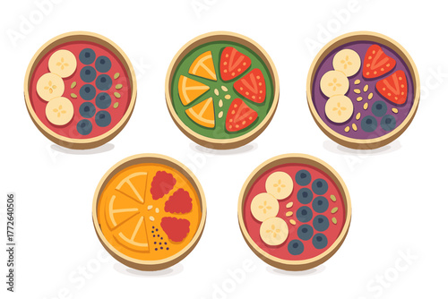 Five colorful healthy breakfast smoothie bowls topped with fresh fruit and seeds