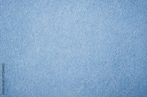 Faded denim material in a soft sky blue shade