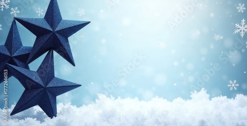Blue Christmas star decorations in the snow. Festive winter holiday background with snowflakes and glitter. Banner with copy space