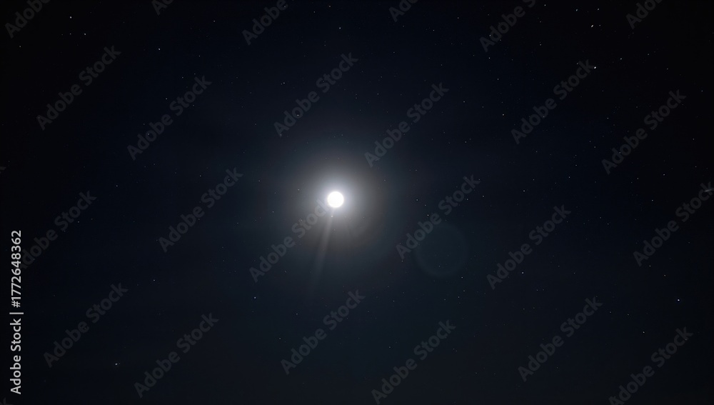 Fototapeta premium Bright full moon illuminating a clear night sky, seasonal change