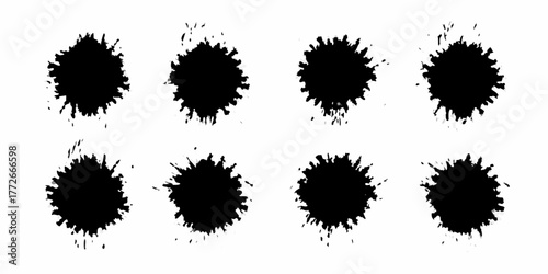Collection of eight black ink splatter brush strokes on a white background